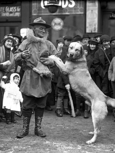 Arthur T. Walden and his winning chinook sled dog celebrate after a 123-mile race in 1922.