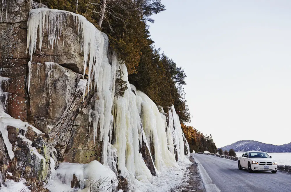 In winter, the ocean itself isn't the only dazzling sight along Sargent Drive. Ice formations on the adjacent cliffs make it tough to keep your eyes on the road.