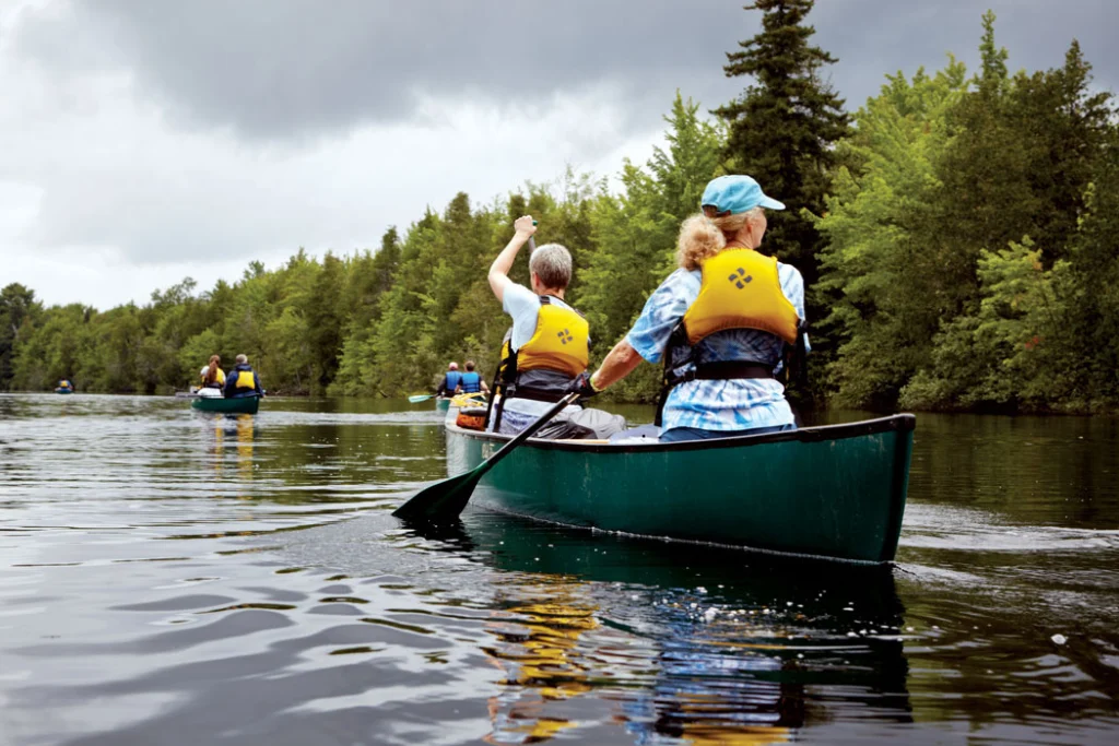 a family canoeing on a river
