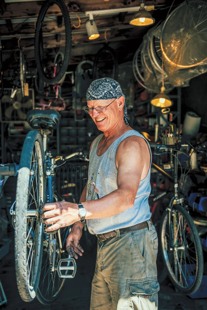 Brad Burkholder tunes a bike at Brad's Bike Rental on Peaks Island.