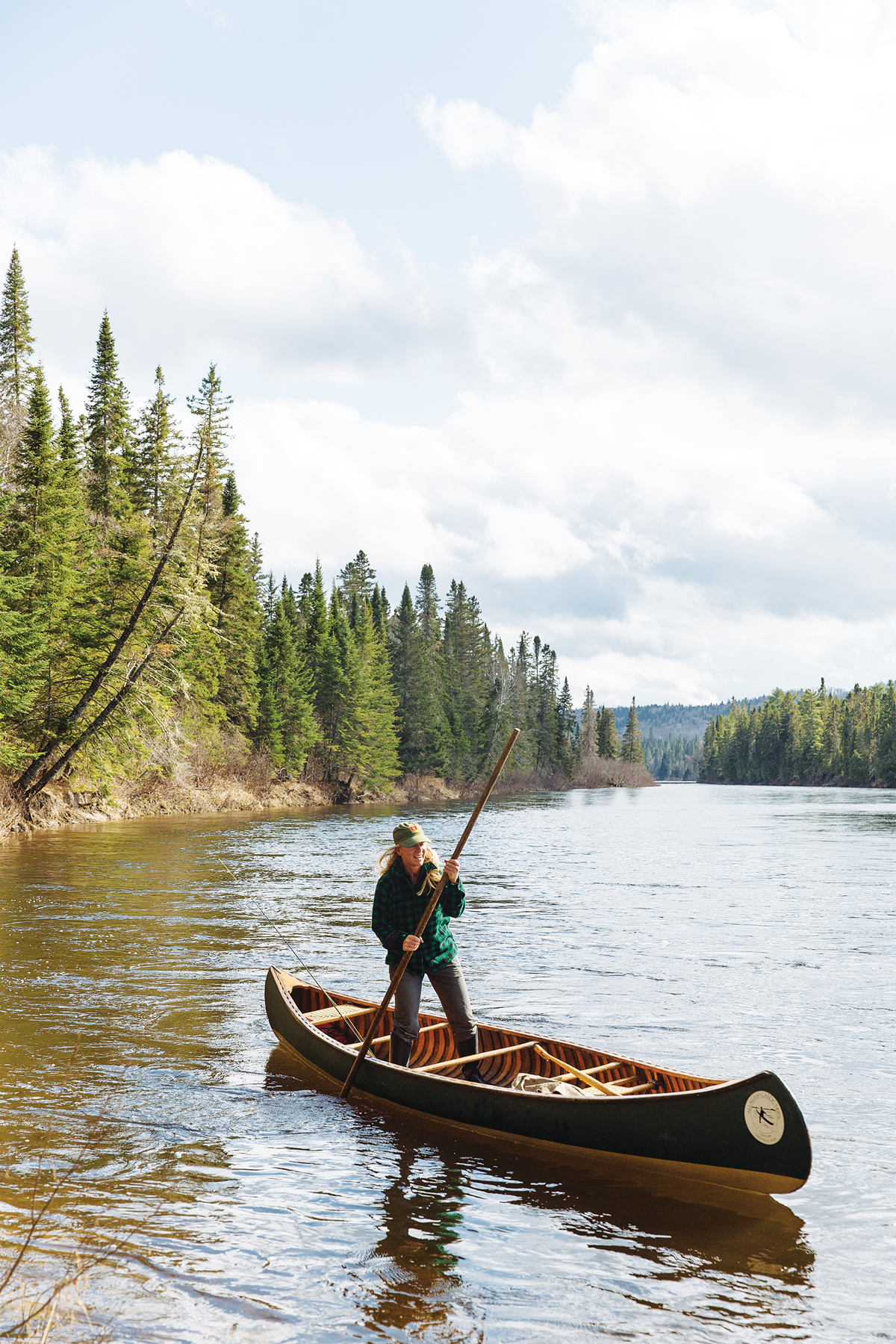 Both Lani Cochrane and Chip Cochrane (above) are National Canoe Poling Champions, adept at navigating canoes upright using a long wooden pole with a metal “shoe.”