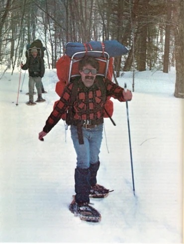 man wearing Maine snowshoe