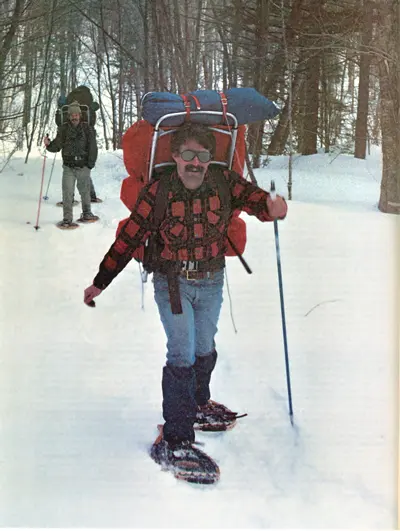 man wearing Maine snowshoe