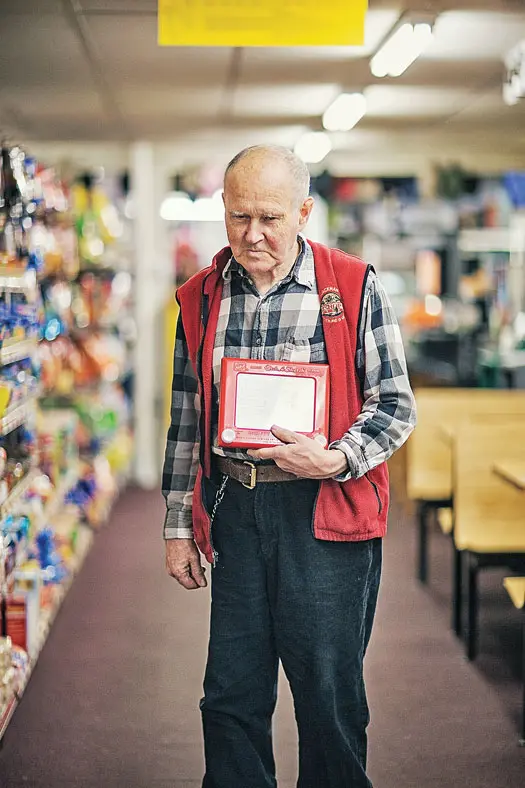 Man with etch-a-sketch