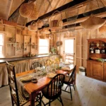 rustic dining room with wicker baskets hanging from ceiling