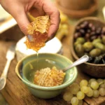 honeycomb in bowl filled with honey