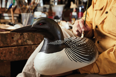 Steve Brettell painting a loon