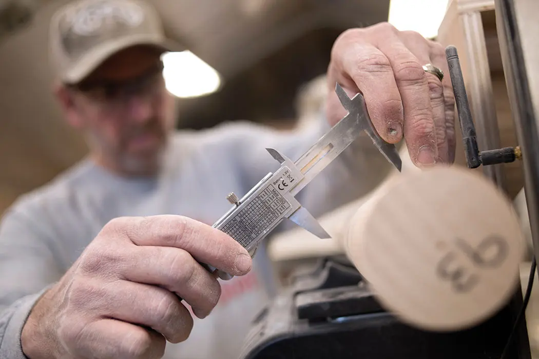 man carving bat