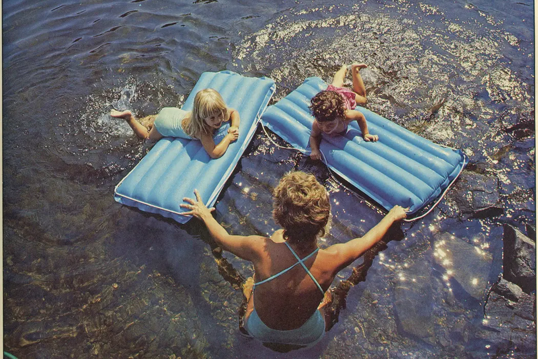 Woman swimming with children Damariscotta Lake 1984