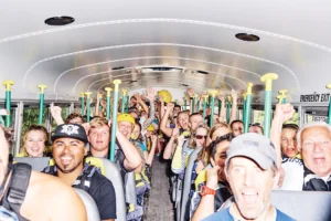 alrge group of people in bus with paddles