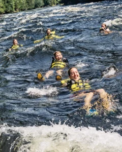 people swimming with life vests on