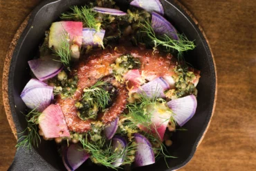 Tipo's charred Mediterranean octopus with fregola sarda, chermoula, and fennel.