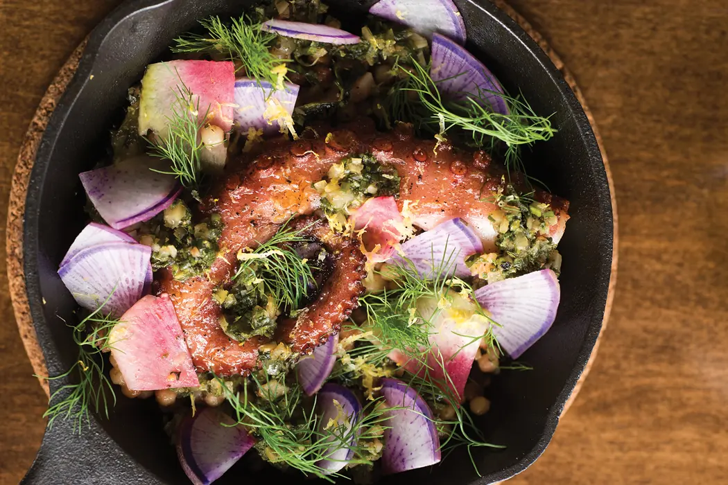 Tipo's charred Mediterranean octopus with fregola sarda, chermoula, and fennel.