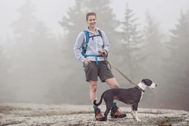 woman walking dog on Great Pond Mountain