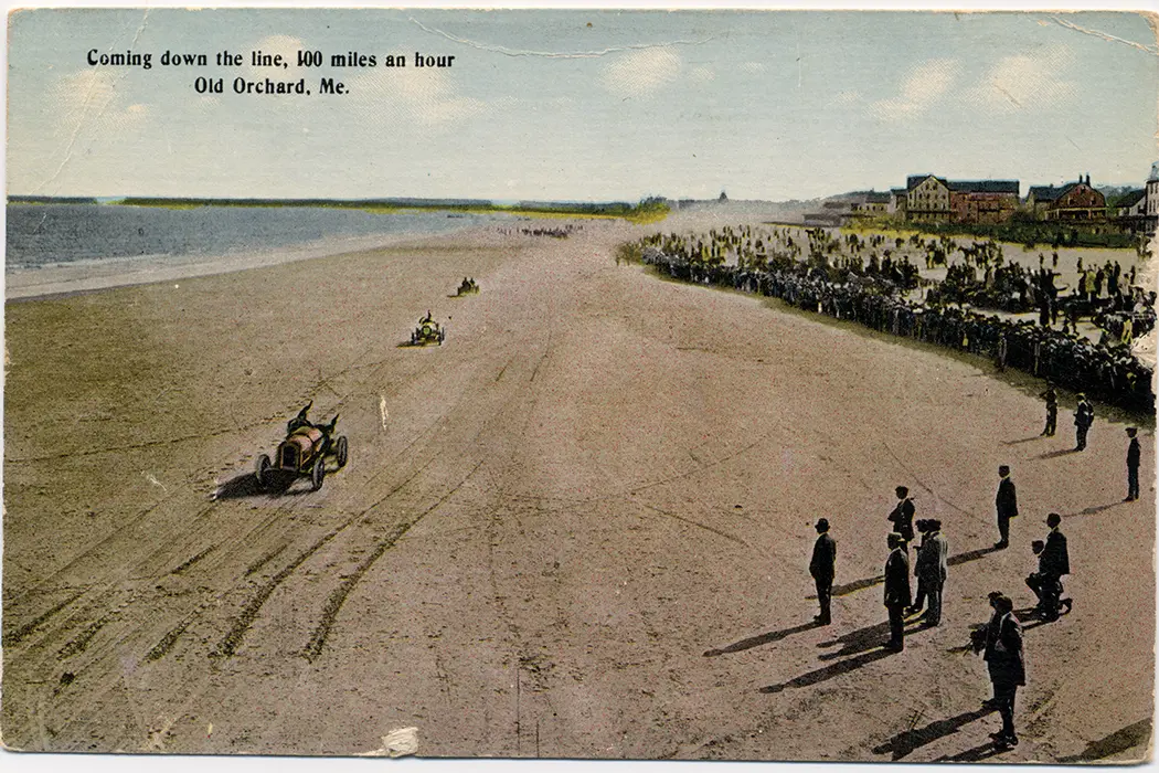 Auto-race enthusiasts cheer drivers zooming toward the Old Orchard Beach pier