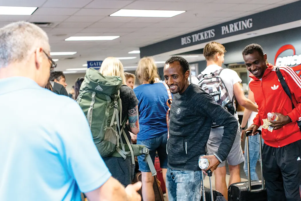 beacon of welcome Tariku, center, and Markos arrive at the Portland bus terminal on an August evening after making an 18-hour trip from Ethiopia.