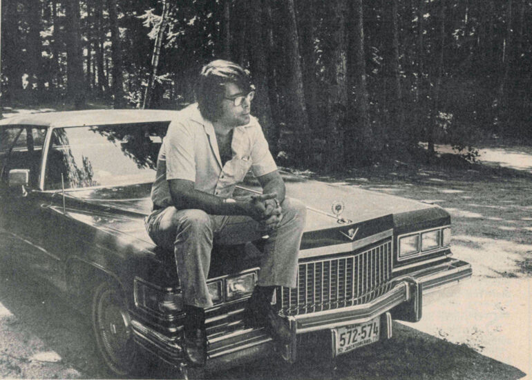 Stephen King, pictured on the hood of his Cadillac.