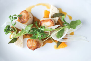 Musette - Maine scallops with butternut puree, orange reduction, fennel, arugula, and crispy sage.