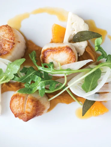 Musette - Maine scallops with butternut puree, orange reduction, fennel, arugula, and crispy sage.