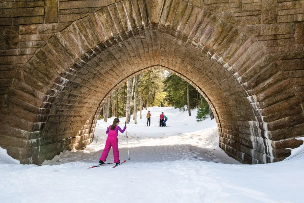 Acadia’s groomed carriage roads pass through the park’s famed stone arch bridges and are excellent to cross-country ski under