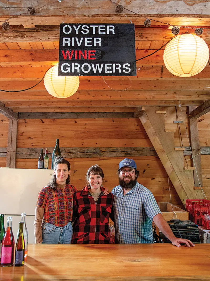 Barn Swallows Joanna Spinks, Oyster River creative director, and Oyster River cofounders Allie Willenbrink and Brian Smith share pizza-night bartending duties.