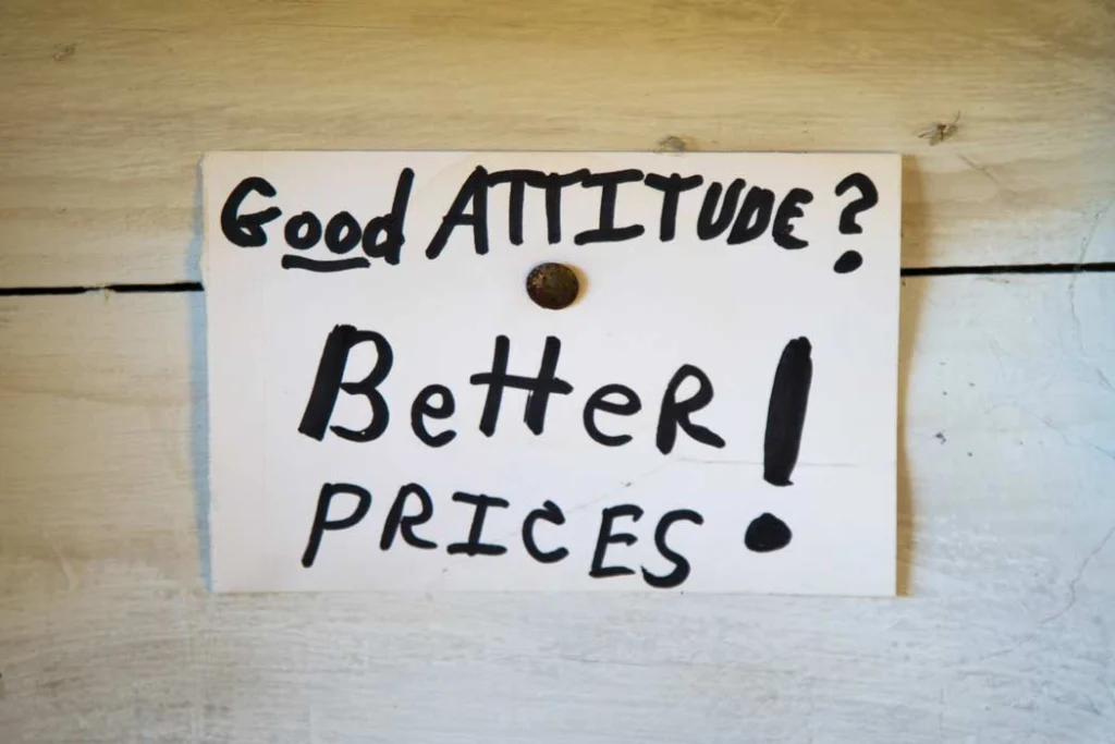 "Good attitude, better prices!" sign at Dave's Bottles in Friendship, Maine