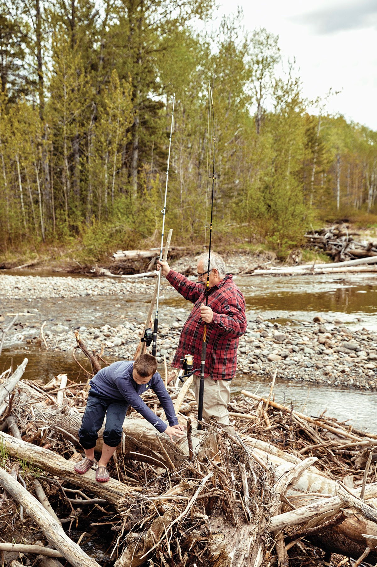 Bubier and his grandson, Eben, fish in Wildcat Brook at the northern edge of the North Maine Woods.