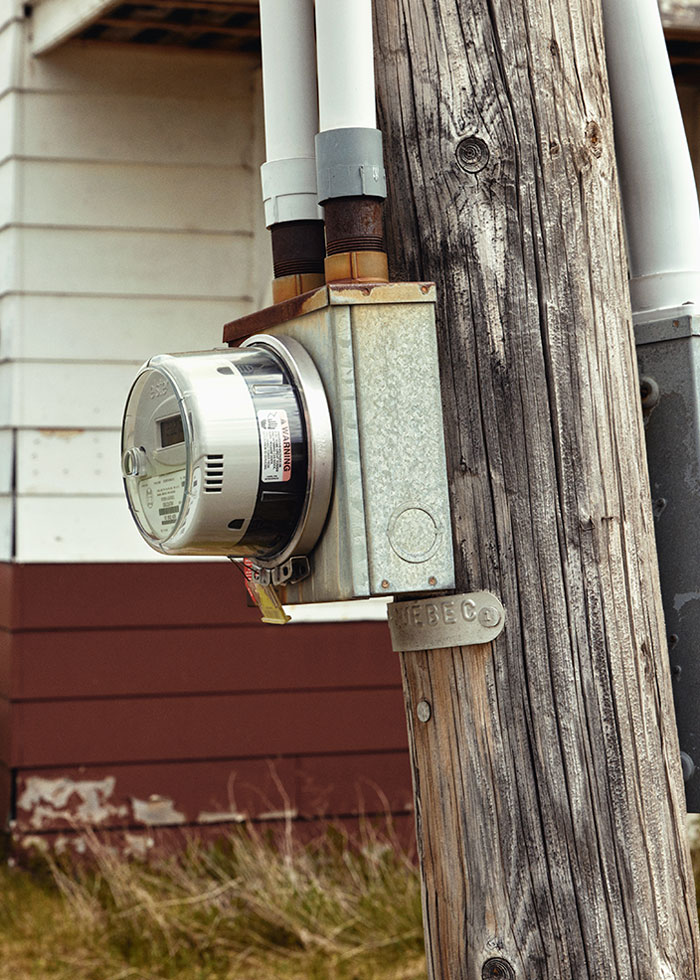 A Maine house’s electric meter is on a pole on the Quebec side, accessible to Canadian meter readers