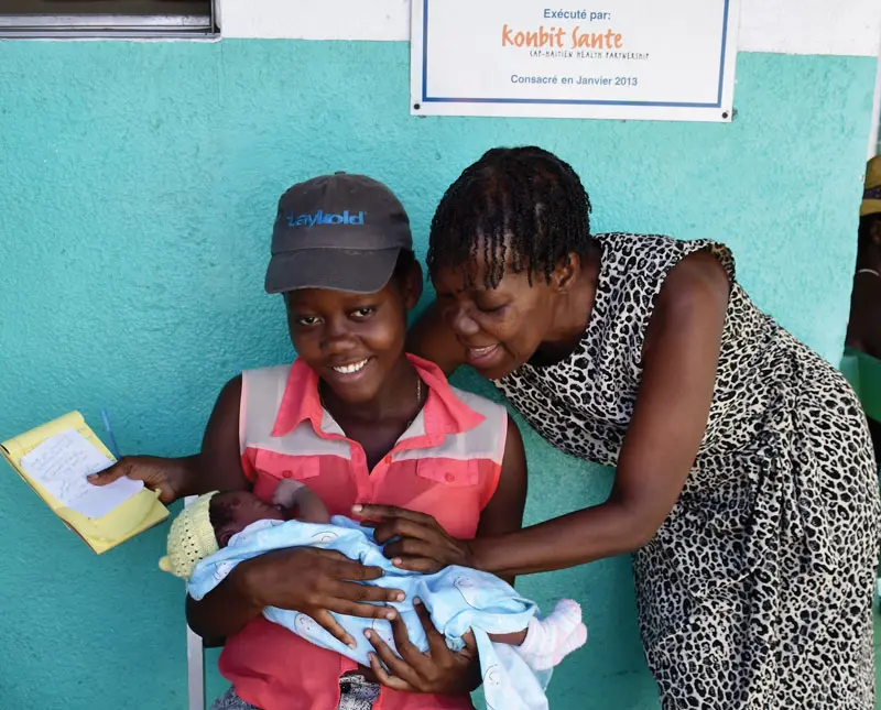 A mother and newborn get care at Fort Saint Michel Health Center, a clinic supported by Konbit Sante.