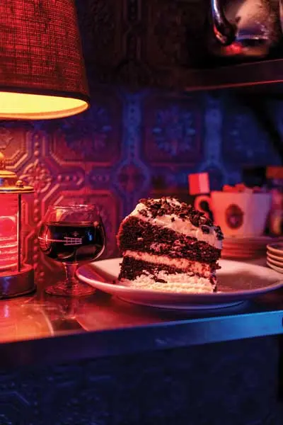 A glass of wine and chocolate cake at Maps, in Portland, Maine