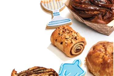 Hanukkah cookies, and, from top to bottom, chocolate babka, Nutella-rolled rugelach, potato knish, sliced babka, and black-and-white cookie from Tin Pan Bakery in Portland Maine