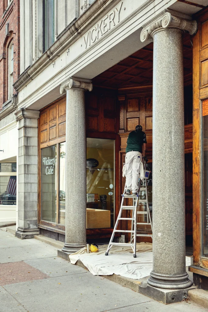 A worker spruces up the Vickery Building