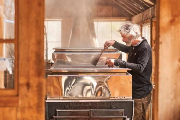 During the spring harvest, Michael Romanyshyn boils sap in a wood-fired evaporator and sells his Temple Tappers brand of birch syrup to specialty grocers and restaurants.