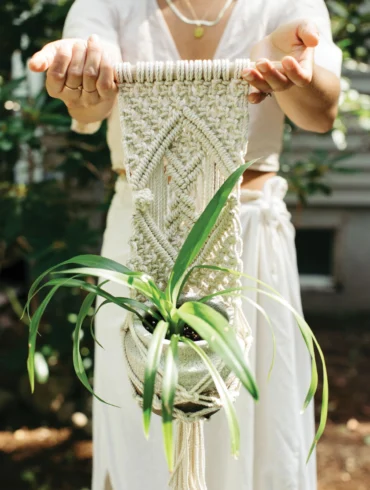 macramé artist Christina Hill presenting a plant hanger