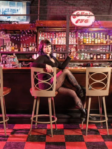 Kathryn Taylor at the bar of Geno's Rock Club