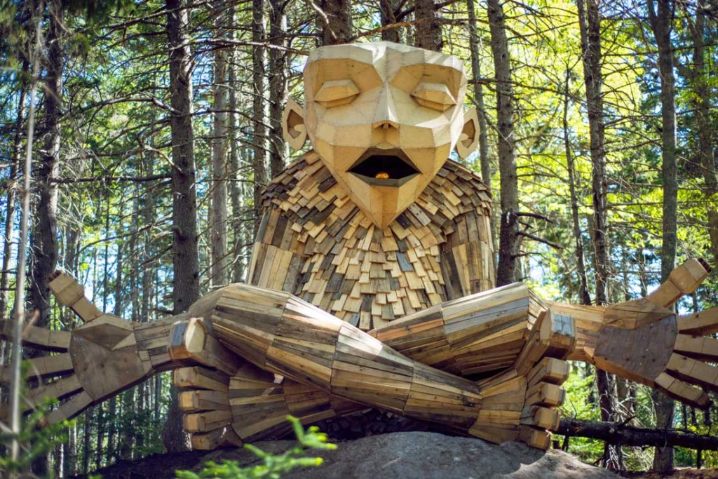 A giant troll practicing mindfulness in the woods of the Coastal Maine Botanical Gardens in Boothbay Harbor