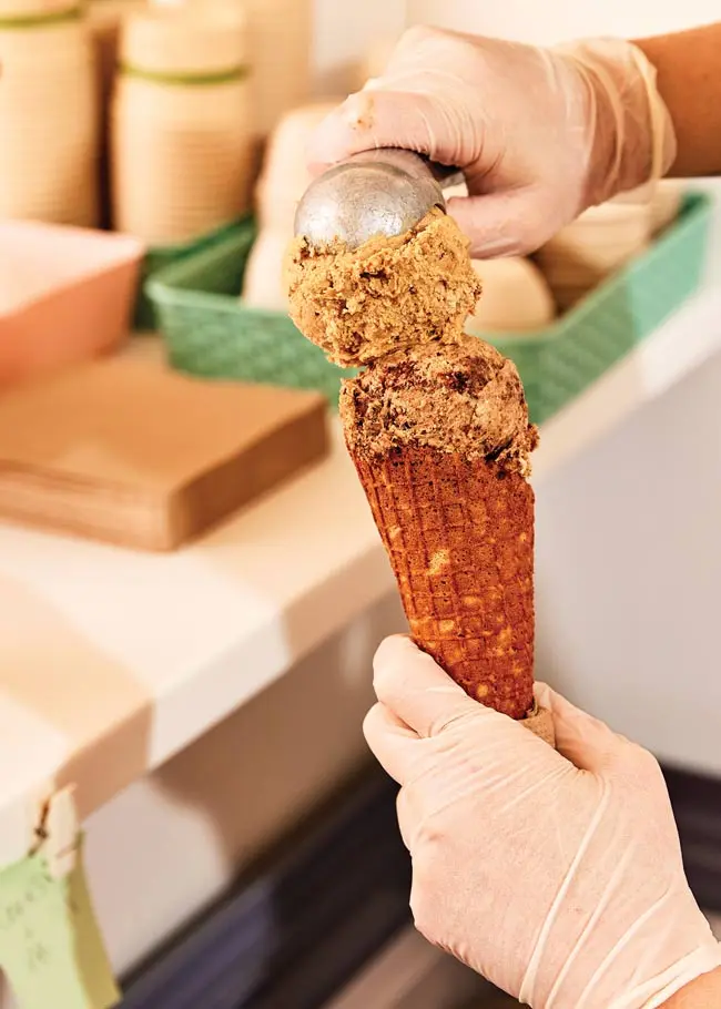 A scoop of peanut-butter cookie atop a scoop of cookies and cream at Portland's new plant-based ice cream shop, Sticky Sweet
