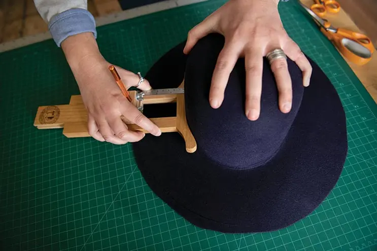 At Mad Patti Hat Co., Meg Patti’s tools include wooden rounding jacks used for cutting a brim to size