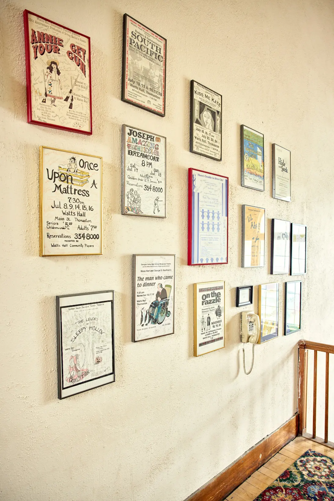 Inside Watts Hall, posters from decades of community theater.