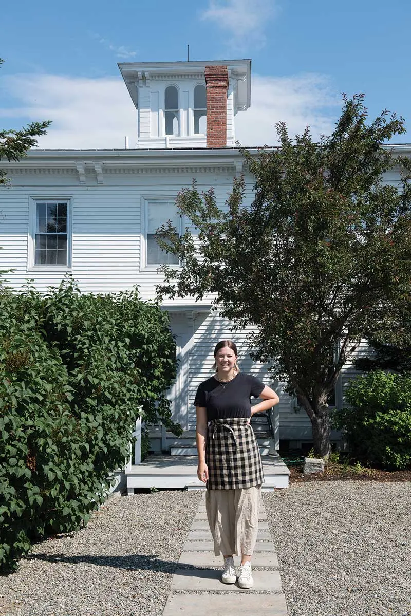 Seven Lakes Inn proprietor Jordan Kindy Shaw beneath the inn’s distinctive cupola.