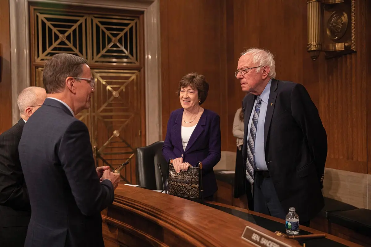 UNE president James Herbert in Washington, DC, with Susan Collins and Bernie Sanders