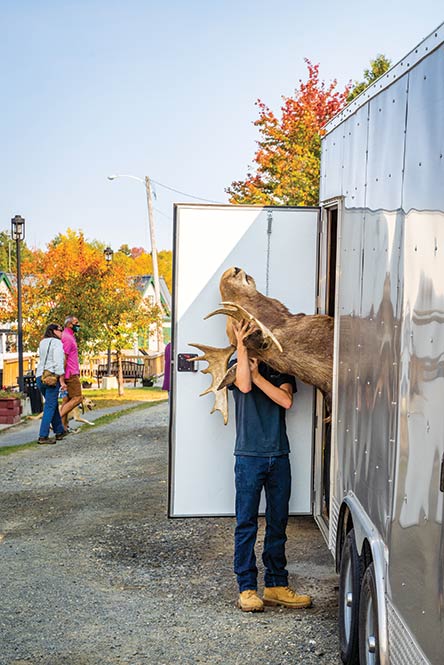 A literal moose head is loaded into Kamp Kamp at the Moosehead Lake Indian Store, Greenville’s storied stop for antiques, kitsch, and taxidermy