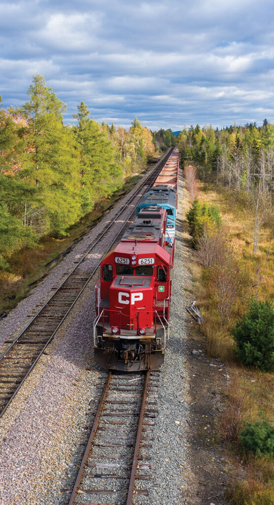 Train tracks paralleling the road, which is part of the Moosehead Lake Scenic Byway