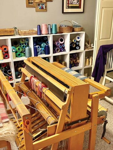 The looms where RiverWoods Exeter resident Andrea Williams weaves her scarves, table runners, and other works