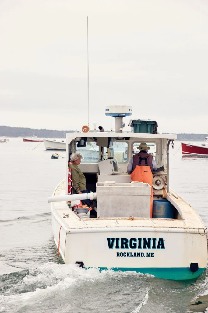 101-year-old lobsterwoman Virginia Oliver on her lobsterboat with her 78-year-old son Max at the helm
