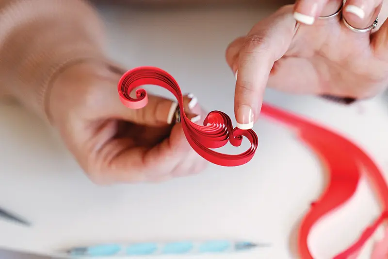 Stacy Bettencourt creates spirals with paper strips
