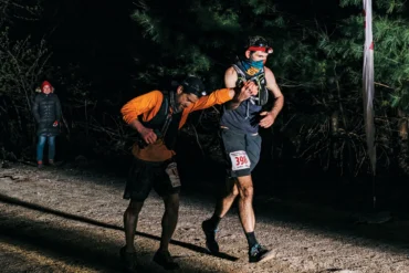 Jay Frontierro (left) and Gordon Collins cross the Riverlands 100 finish line in 2021