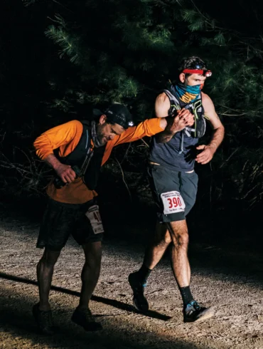 Jay Frontierro (left) and Gordon Collins cross the Riverlands 100 finish line in 2021
