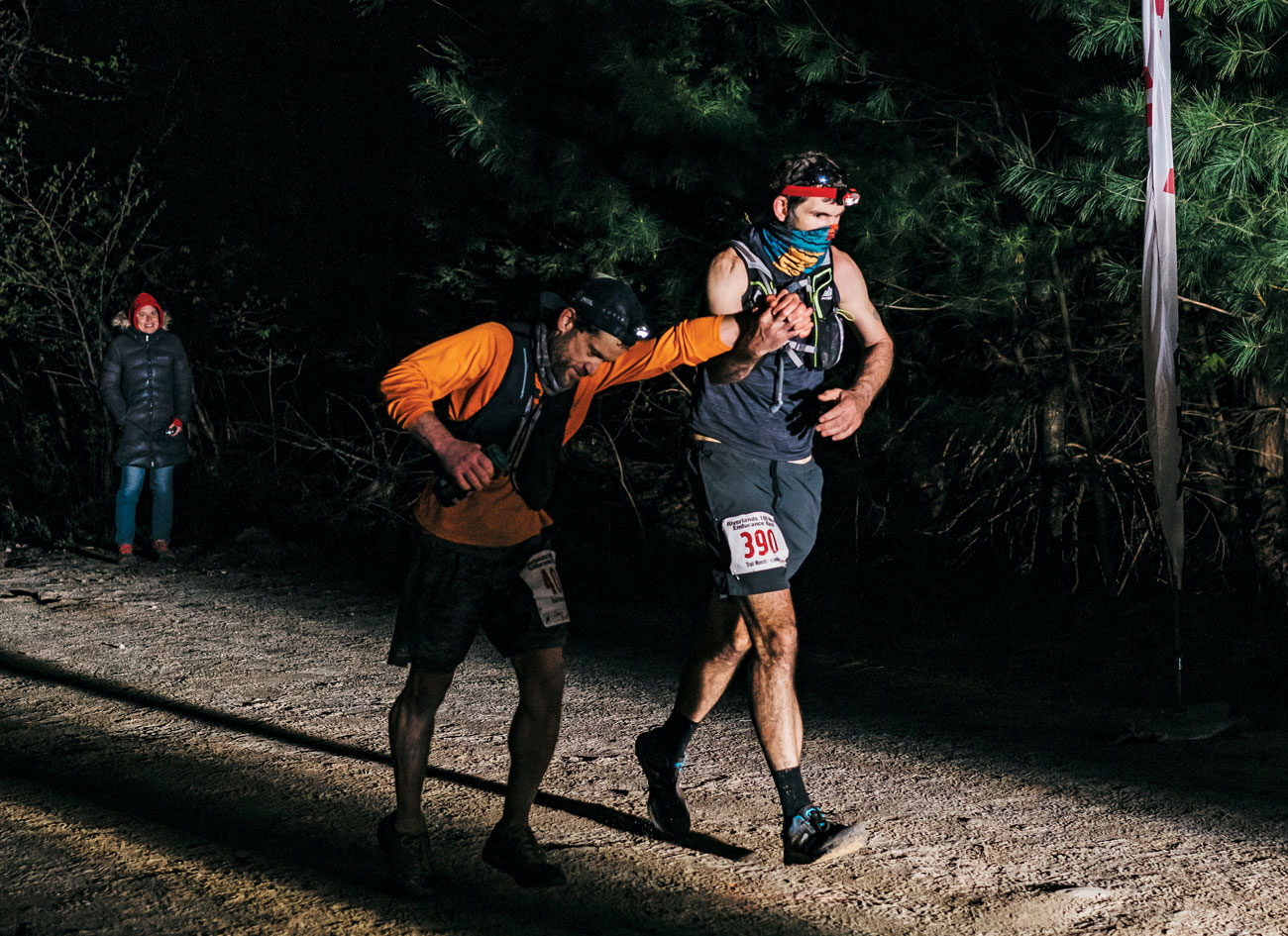 Jay Frontierro (left) and Gordon Collins cross the Riverlands 100 finish line in 2021