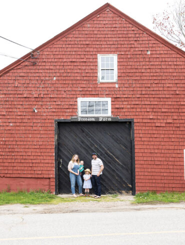 Bridget M. Burns, outside the Freedom Farm barn, with daughters Sinead and Clodagh and husband Kevin.
